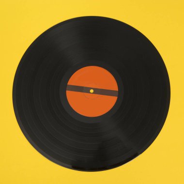 Sarı bir arka plan üzerinde siyah vinil kaydı