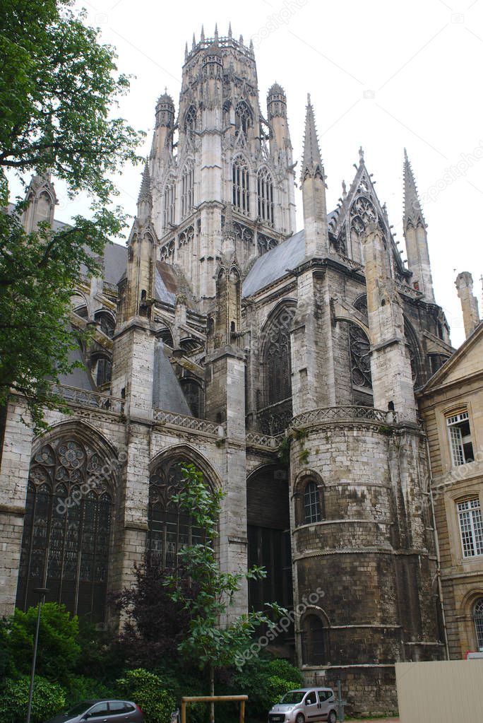 Saint-Ouen Abbey in Rouen in Normandy, France. Gothic style. View of the gardens of the Hotel de Ville, low-angle shot.