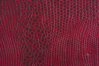 doku, kırmızı deri arka plan. Timsah derisi etkisi