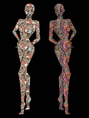 Farklı şekillerde dekore edilmiş iki kadın cesedi kalıpları, siyah arka planda izole edilmiş siluetler.