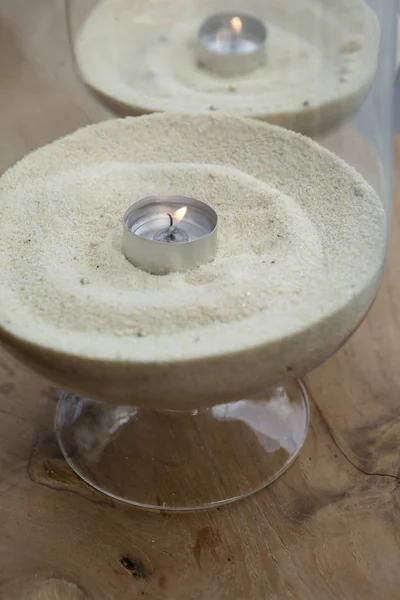 candles in jar  filed with sand