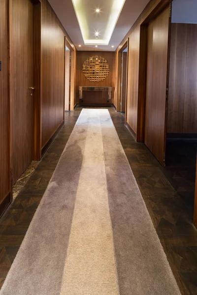 carpet in a luxury apartment hallway with fancy mirror