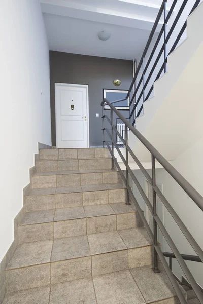 Architecture, modern entryway, interior with tiled stair case