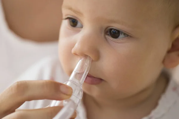 Mother Cleaning Babies Nose Nasal Aspiration Connected Vaccum Cleaner — Stock Photo, Image