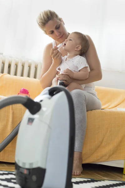 Mother Cleaning Babies Nose Nasal Aspiration Connected Vaccum Cleaner — Stock Photo, Image