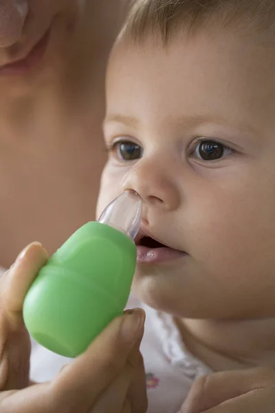 Mother Cleaning Babies Nose Vacuum Pump — Stock Photo, Image