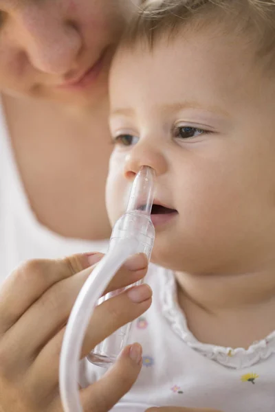 Mother Cleaning Babies Nose Nasal Aspiration Connected Vaccum Cleaner — Stock Photo, Image