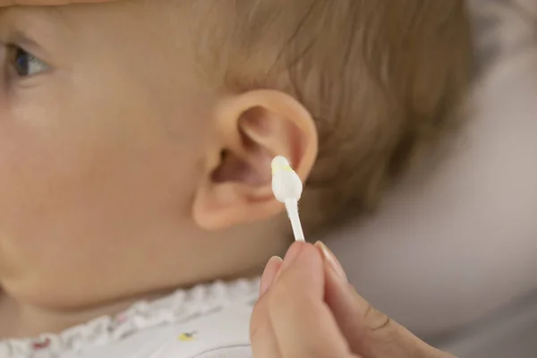 ear wax on cotton swab.baby ear