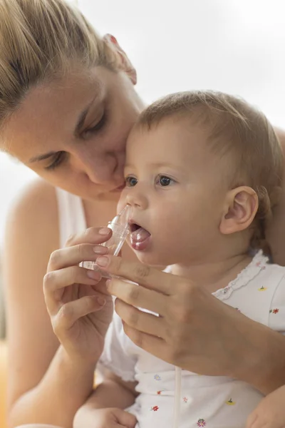 Mother Cleaning Babies Nose Nasal Aspiration Cleaner — Stock Photo, Image