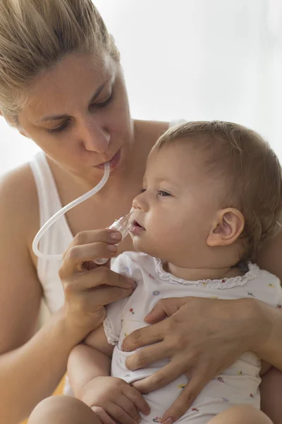 Mother Cleaning Babies Nose Nasal Aspiration Cleaner — Stock Photo, Image