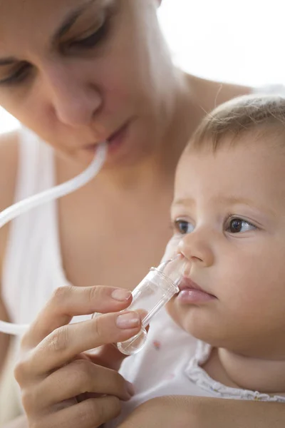 Mother Cleaning Babies Nose Nasal Aspiration Cleaner — Stock Photo, Image