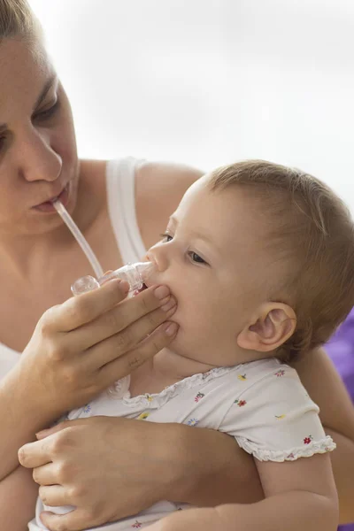 Mother Cleaning Babies Nose Nasal Aspiration Cleaner — Stock Photo, Image