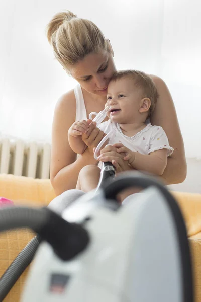 Mother Cleaning Babies Nose Nasal Aspiration Connected Vaccum Cleaner — Stock Photo, Image