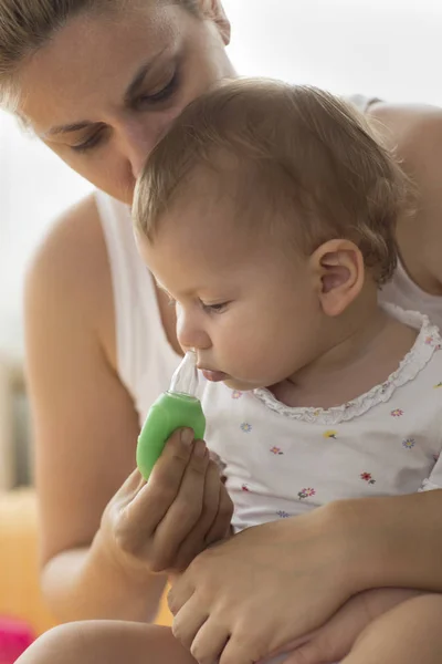 Mother Cleaning Babies Nose Vacuum Pump — Stock Photo, Image