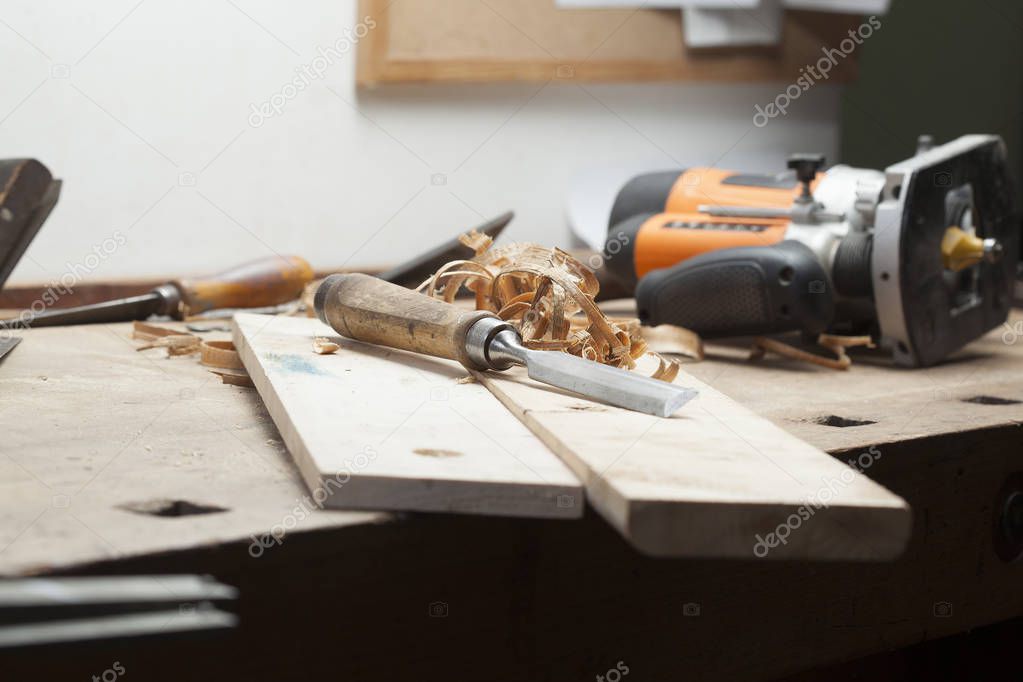 chisel an sawdust on wooden board.copy space