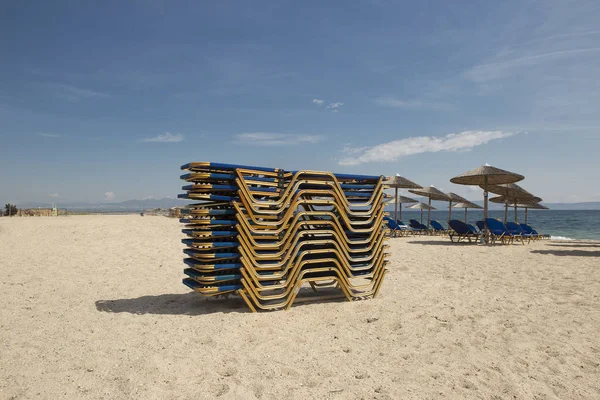 Beutiful sand beach with sun-beds Stock Image