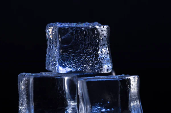 Aesthetic Ice Cubes closeup on black background
