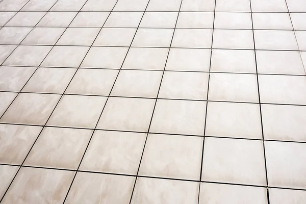 Square tiles on the facade of the building