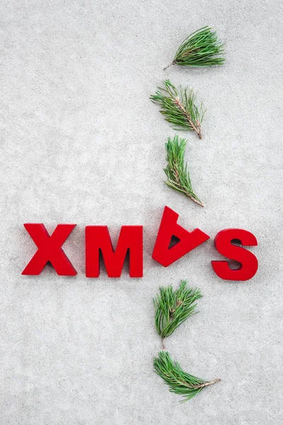 Christmas Theme Green Pine Branches Word Xmas Written Upside — Stock Photo, Image