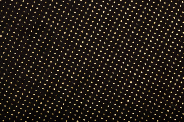 Czarna tkanina ze złotymi metalicznymi kropkami wystrój — Zdjęcie stockowe