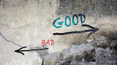 Wall Graffiti to Good versus Bad clipart