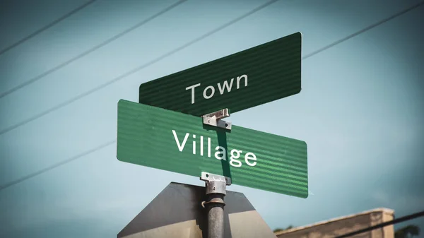 Street Sign to Village versus Town — Stock Photo, Image