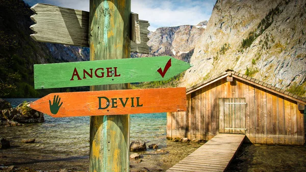 Gatuskylt till Angel Versus Devil — Stockfoto