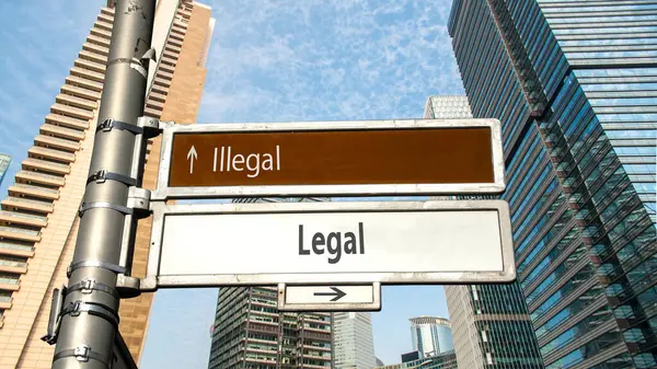 ストリートサインは合法対違法への方向への道 — ストック写真