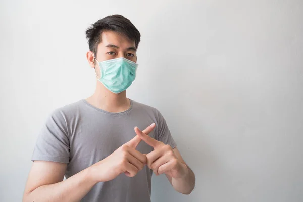 Asian men wear health masks to prevent germs and dust. Thoughts about health care