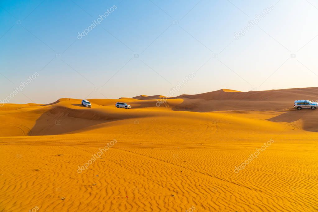 Dubai desert Safari on jeeps,Yellow desert dunes and sky,Red sand Arabian desert near Dubai, United Arab Emirates