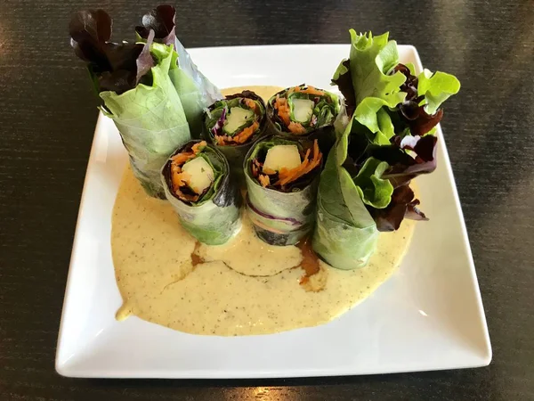 Healthy food on a plate, spring roll.