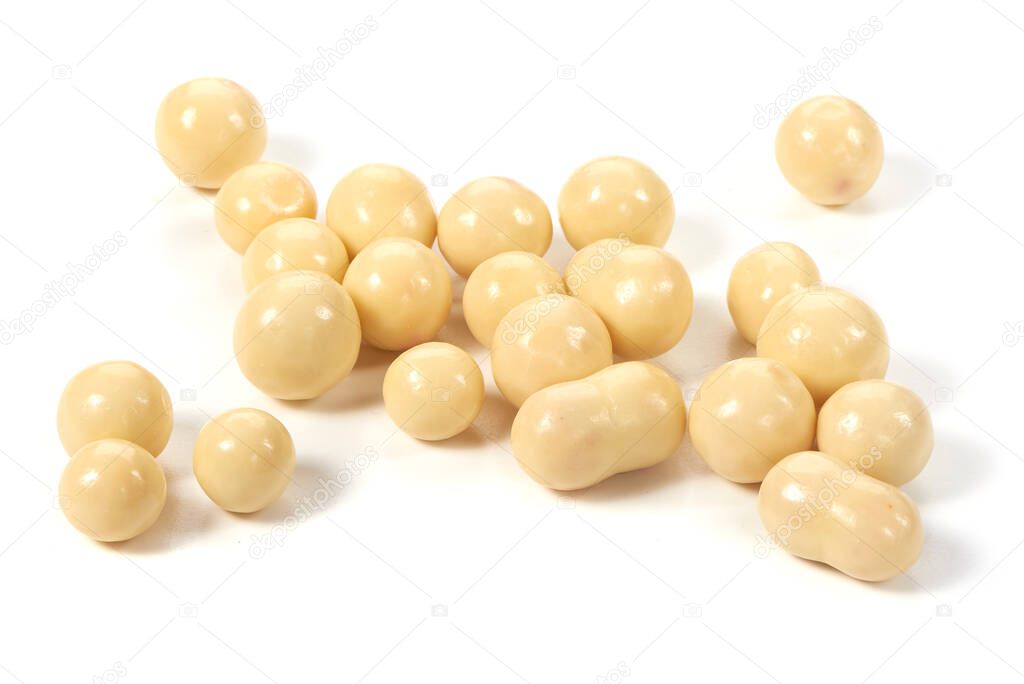 Dried berries in a white chocolate, close-up, isolated on white background.