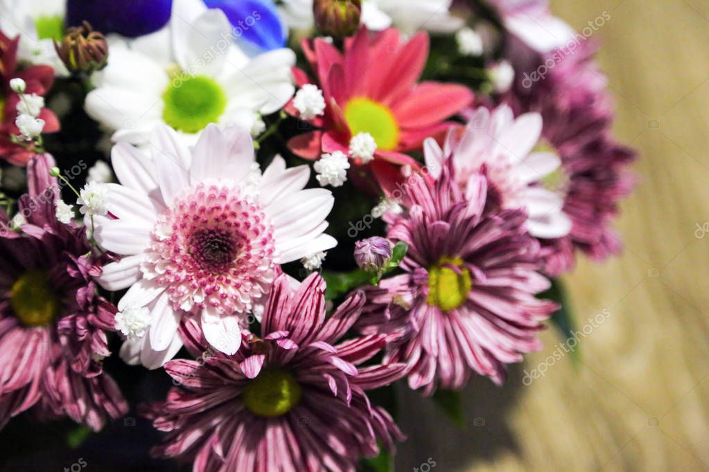 spring flowers in a small bouquet on a wooden background. beautiful bouquet