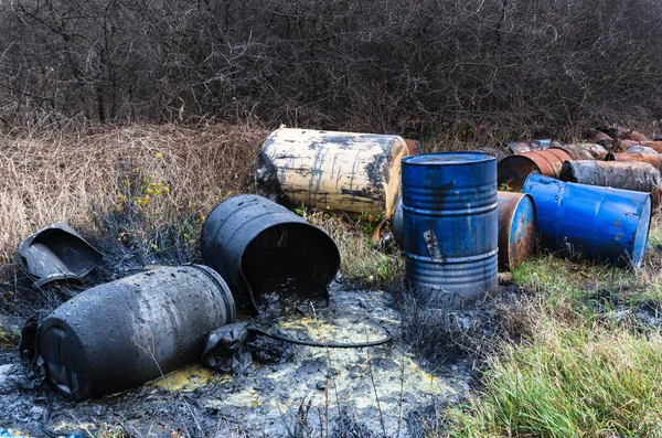 Barrels of toxic waste in nature, pollution of the environment