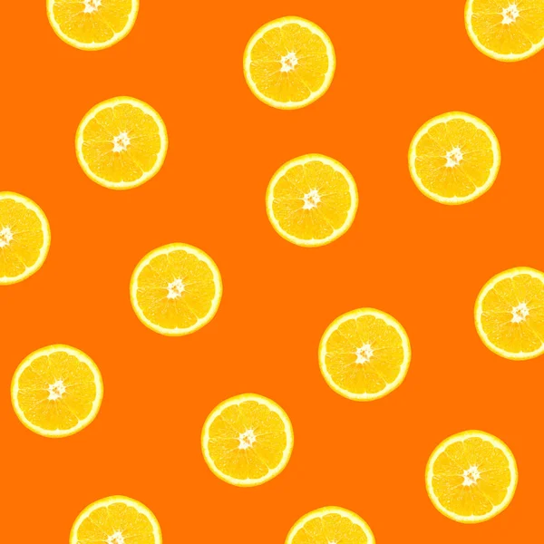 Background of half cut oranges on orange background. backdrop orange slices