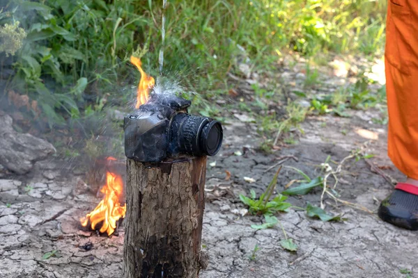 Extinguishing digital technology, the effects of fire. Burnt camera. insured property. non-warranty case