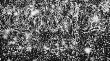 Beyaz parçacıklar yavaş siyah bir arka plan karşı hareket edin. 3D render