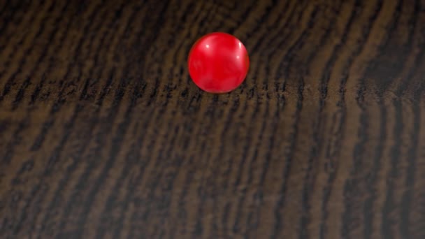 Czerwonego Szkła Piłka Toczy Się Powierzchni Drewnianych Płytkiej Głębi Ostrości — Wideo stockowe