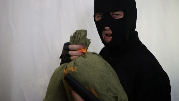 Young Saucy Caucasian Robber Gun Dances Bag Money Rejoices Prey — Stock Video