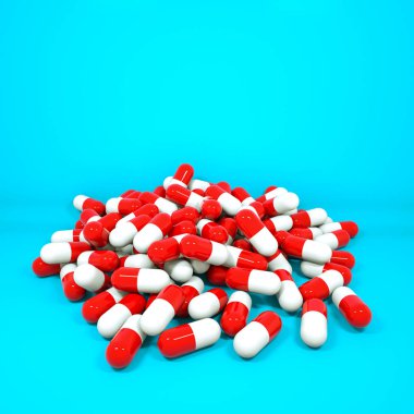 üzerinde kapsül şeklinde üç boyutlu kırmızı-beyaz tabletler