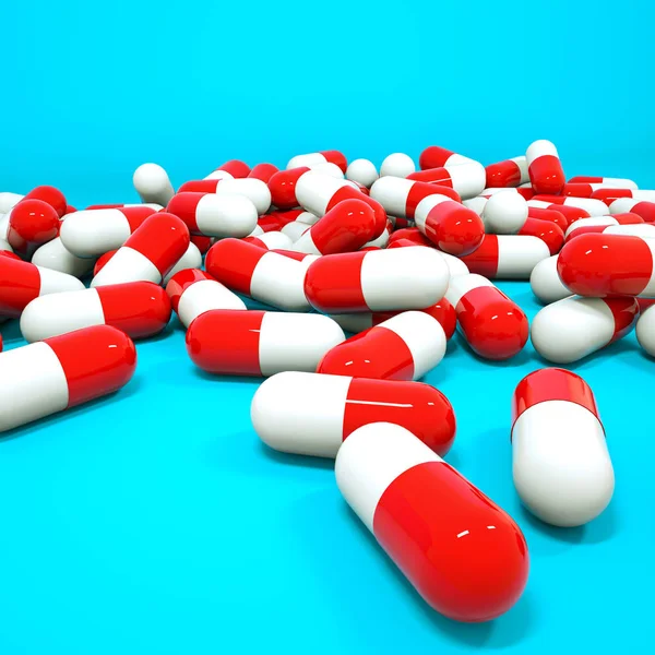 Three-dimensional red-white tablets in the form of capsules on a — Stock Photo, Image