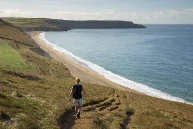 Walking Coast Path above Porthleven Sands clipart