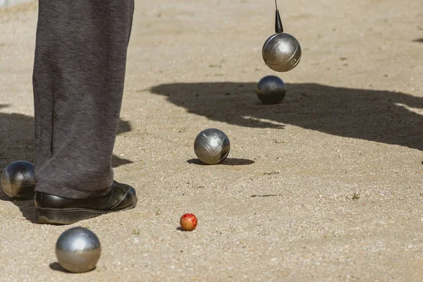 Petanque balls on the game track while the match is played