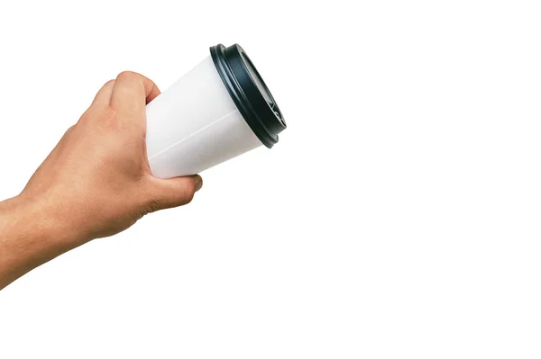 Isolated Takeaway cup, for Coffee, Tea in a guy s hand with a black cap. on a white background. — Stock Photo, Image