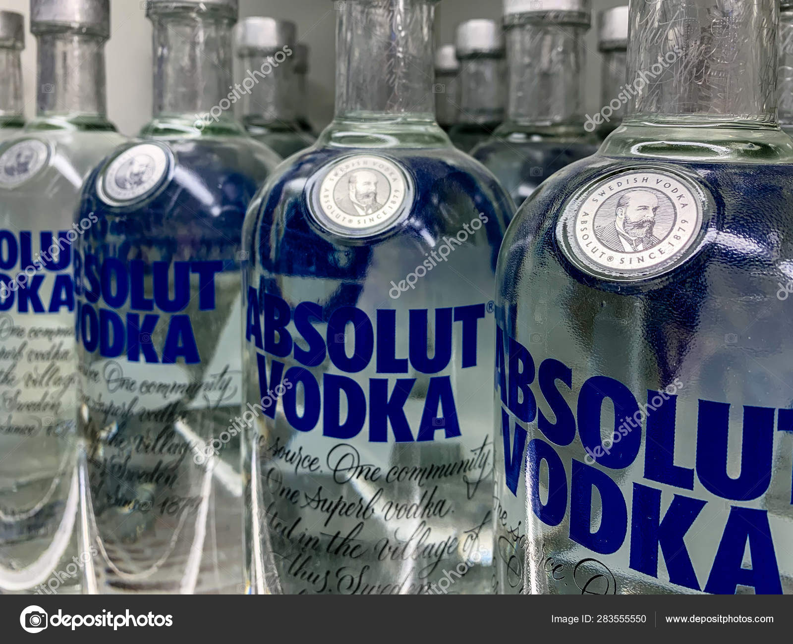 vodka bottles on a shelf in a store absolut vodka is a famous brand of vodka