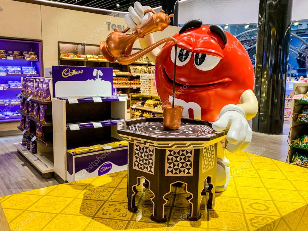 M&M mascot figure pouring Turkish coffee in a mug. Adaption of candy advertising of the company MARS for different regions and countries. Istanbul, Turkey - April 2019