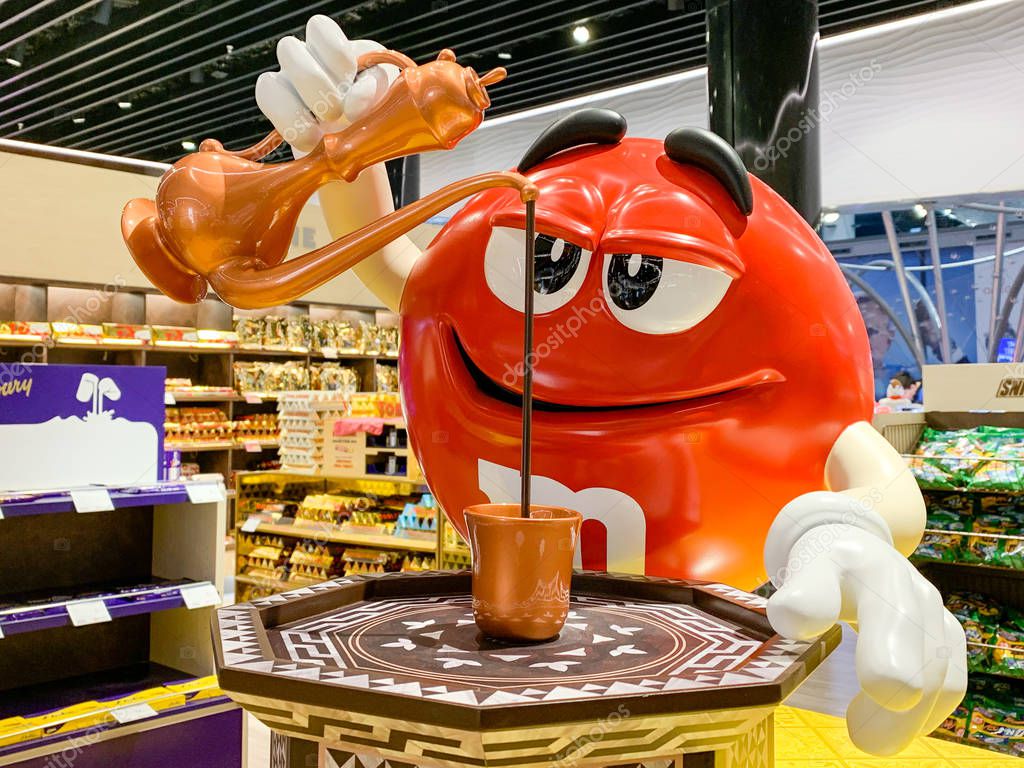M&M mascot figure pouring Turkish coffee in a mug. Adaption of candy advertising of the company MARS for different regions and countries. Istanbul, Turkey - April 2019