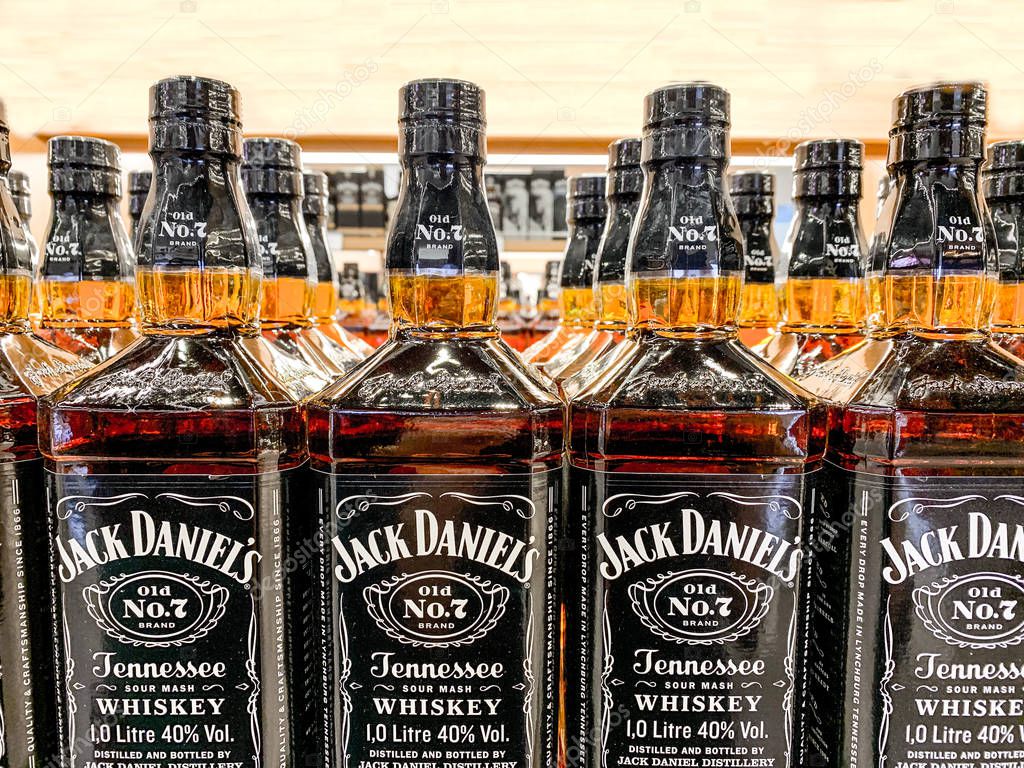 Row of Jack Daniels Whiskey bottles on a store shelf, selective focus. Istanbul, Turkey - April 2019