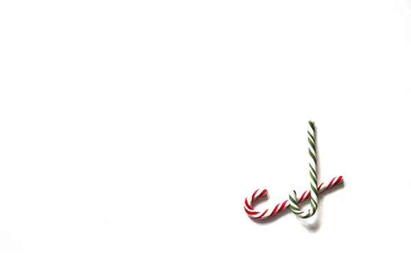 Two Crossed Striped Christmas Candy Canes White Background Winter Copy — Stock Photo, Image