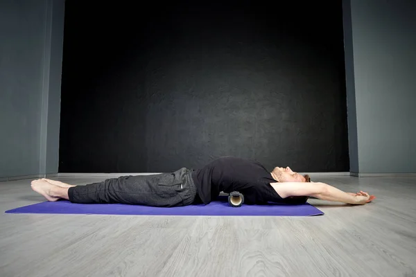 Young Athletic Man Working Out His Spine Muscles Roller — Stock Photo, Image